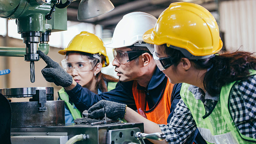 Production foreman trains two employees how to use machine From Gaps to Gains — Getting Real on Closing the Skills Gap
